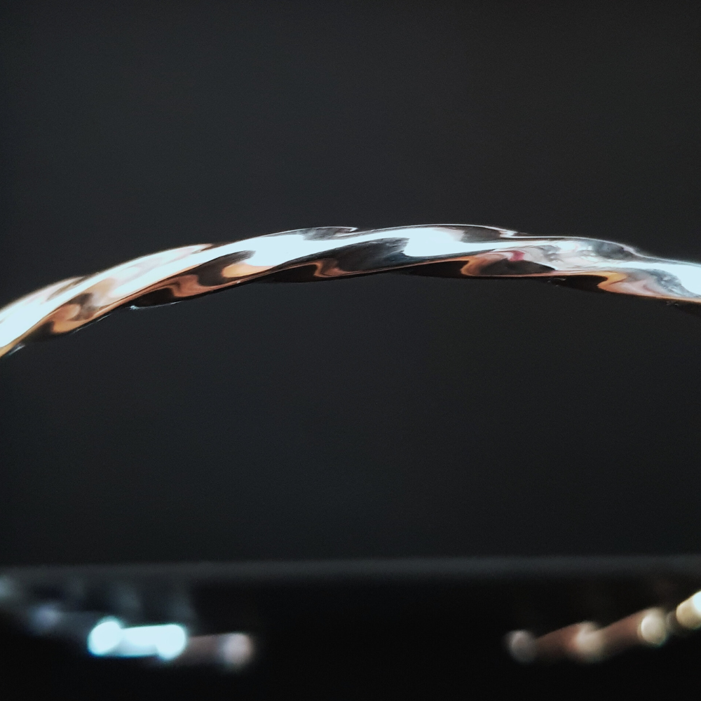 This Beautiful Silver Twist Bangle is a 3mm wide rounded design in 925 twisted silver work with a high polish and looks amazing. The 925 Silver Twist Bangle is designed to be worn on it's own or added to in multiples. It is 65mm round and slides nicely over the hand.