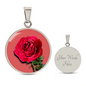 Rose Birth Flower June Graphic Epoxy Disc Necklace. Clear shiny epoxy shows a red petal flower and green stem on a pink background. The jewellery is made of high quality surgical steel or with an 18k gold finish option with an option to engrave a short love you message or special date. Luxury Necklace: 18-22" (45-56cm) adjustable
Circle Pendant: 0.9” x 0.9” (23.5mm x 23.5mm)