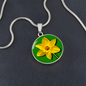 Daffodil Birth Flower March Graphic Epoxy Disc Necklace. Clear shiny epoxy shows a yellow petal flower on a green background. The jewellery is made of high quality surgical steel or with an 18k gold finish option with an option to engrave a short love you message or special date. Luxury Necklace: 18-22" (45-56cm) adjustable
Circle Pendant: 0.9” x 0.9” (23.5mm x 23.5mm)