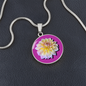 Aster Birth Flower September Graphic Epoxy Disc Necklace. Clear shiny epoxy shows a light yellow petal flower on a lighter pink background. The jewellery is made of high quality surgical steel or with an 18k gold finish option with an option to engrave a short love you message or special date. Luxury Necklace: 18-22" (45-56cm) adjustable
Circle Pendant: 0.9” x 0.9” (23.5mm x 23.5mm)