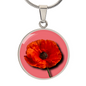 Poppy Birth Flower August Graphic Epoxy Disc Necklace. Clear shiny epoxy shows a red petal flower with a dark canter on a lighter pink background. The jewellery is made of high quality surgical steel or with an 18k gold finish option with an option to engrave a short love you message or special date. Luxury Necklace: 18-22" (45-56cm) adjustable
Circle Pendant: 0.9” x 0.9” (23.5mm x 23.5mm)