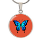 Stunning Blue Butterfly Personalised Engraved Circle Necklace on terracotta orange background. Polished surgical steel or with an 18k gold finish option. Necklace: 18-22" adjustable.
Circle Pendant: 0.9” x 0.9” (23.5mm x 23.5mm)