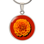 Marigold Birth Flower October Graphic Epoxy Disc Necklace. Clear shiny epoxy shows an orange petal flower on a darker red background. The jewellery is made of high quality surgical steel or with an 18k gold finish option with an option to engrave a short love you message or special date. Luxury Necklace: 18-22" (45-56cm) adjustable
Circle Pendant: 0.9” x 0.9” (23.5mm x 23.5mm)