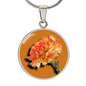 Carnation Birth Flower January Graphic Epoxy Disc Necklace. Clear shiny epoxy shows an orange flower on a green stalk with a darker orange background. The jewellery is made of high quality surgical steel or with an 18k gold finish option with an option to engrave a short love you message or special date. Luxury Necklace: 18-22" (45-56cm) adjustable
Circle Pendant: 0.9” x 0.9” (23.5mm x 23.5mm)