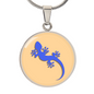 Electric Blue Gecko Graphic Personalised Engraved Disc Necklace on light caramel background. Polished surgical steel or with an 18k gold finish option. Necklace: 18-22" adjustable.
Circle Pendant: 0.9” x 0.9” (23.5mm x 23.5mm)