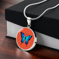 Stunning Blue Butterfly Personalised Engraved Circle Necklace on terracotta orange background. Polished surgical steel or with an 18k gold finish option. Necklace: 18-22" adjustable.
Circle Pendant: 0.9” x 0.9” (23.5mm x 23.5mm)