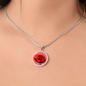 Poppy Birth Flower August Graphic Epoxy Disc Necklace. Clear shiny epoxy shows a red petal flower with a dark canter on a lighter pink background. The jewellery is made of high quality surgical steel or with an 18k gold finish option with an option to engrave a short love you message or special date. Luxury Necklace: 18-22" (45-56cm) adjustable
Circle Pendant: 0.9” x 0.9” (23.5mm x 23.5mm)
