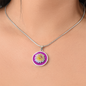 Aster Birth Flower September Graphic Epoxy Disc Necklace. Clear shiny epoxy shows a light yellow petal flower on a lighter pink background. The jewellery is made of high quality surgical steel or with an 18k gold finish option with an option to engrave a short love you message or special date. Luxury Necklace: 18-22" (45-56cm) adjustable
Circle Pendant: 0.9” x 0.9” (23.5mm x 23.5mm)