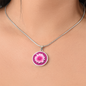 Chrysanthemums Birth Flower November Graphic Epoxy Disc Necklace. Clear shiny epoxy shows a two tone light pink petal flower on a darker pink background. The jewellery is made of high quality surgical steel or with an 18k gold finish option with an option to engrave a short love you message or special date. Luxury Necklace: 18-22" (45-56cm) adjustable
Circle Pendant: 0.9” x 0.9” (23.5mm x 23.5mm)
