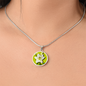 Lily Birth Flower May Graphic Epoxy Disc Necklace. Clear shiny epoxy shows a white petal flower with green stem on a lime green background. The jewellery is made of high quality surgical steel or with an 18k gold finish option with an option to engrave a short love you message or special date. Luxury Necklace: 18-22" (45-56cm) adjustable
Circle Pendant: 0.9” x 0.9” (23.5mm x 23.5mm)