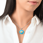 Daisy Birth Flower April Graphic Epoxy Disc Necklace. Clear shiny epoxy shows a white petal flower with yellow canter on a light blue background. The jewellery is made of high quality surgical steel or with an 18k gold finish option with an option to engrave a short love you message or special date. Luxury Necklace: 18-22" (45-56cm) adjustable
Circle Pendant: 0.9” x 0.9” (23.5mm x 23.5mm)