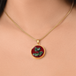 Holly Birth Flower December Graphic Epoxy Disc Necklace. Clear shiny epoxy shows a red berry on green spikey leaf with a darker red background. The jewellery is made of high quality surgical steel or with an 18k gold finish option with an option to engrave a short love you message or special date. Luxury Necklace: 18-22" (45-56cm) adjustable
Circle Pendant: 0.9” x 0.9” (23.5mm x 23.5mm)