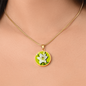Lily Birth Flower May Graphic Epoxy Disc Necklace. Clear shiny epoxy shows a white petal flower with green stem on a lime green background. The jewellery is made of high quality surgical steel or with an 18k gold finish option with an option to engrave a short love you message or special date. Luxury Necklace: 18-22" (45-56cm) adjustable
Circle Pendant: 0.9” x 0.9” (23.5mm x 23.5mm)