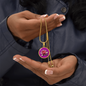 Water Lily Birth Flower July Graphic Epoxy Disc Necklace. Clear shiny epoxy shows a light pink petal flower on a darker pink background. The jewellery is made of high quality surgical steel or with an 18k gold finish option with an option to engrave a short love you message or special date. Luxury Necklace: 18-22" (45-56cm) adjustable
Circle Pendant: 0.9” x 0.9” (23.5mm x 23.5mm)