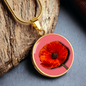 Poppy Birth Flower August Graphic Epoxy Disc Necklace. Clear shiny epoxy shows a red petal flower with a dark canter on a lighter pink background. The jewellery is made of high quality surgical steel or with an 18k gold finish option with an option to engrave a short love you message or special date. Luxury Necklace: 18-22" (45-56cm) adjustable
Circle Pendant: 0.9” x 0.9” (23.5mm x 23.5mm)