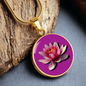Water Lily Birth Flower July Graphic Epoxy Disc Necklace. Clear shiny epoxy shows a light pink petal flower on a darker pink background. The jewellery is made of high quality surgical steel or with an 18k gold finish option with an option to engrave a short love you message or special date. Luxury Necklace: 18-22" (45-56cm) adjustable
Circle Pendant: 0.9” x 0.9” (23.5mm x 23.5mm)