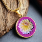 Aster Birth Flower September Graphic Epoxy Disc Necklace. Clear shiny epoxy shows a light yellow petal flower on a lighter pink background. The jewellery is made of high quality surgical steel or with an 18k gold finish option with an option to engrave a short love you message or special date. Luxury Necklace: 18-22" (45-56cm) adjustable
Circle Pendant: 0.9” x 0.9” (23.5mm x 23.5mm)