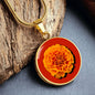 Marigold Birth Flower October Graphic Epoxy Disc Necklace. Clear shiny epoxy shows an orange petal flower on a darker red background. The jewellery is made of high quality surgical steel or with an 18k gold finish option with an option to engrave a short love you message or special date. Luxury Necklace: 18-22" (45-56cm) adjustable
Circle Pendant: 0.9” x 0.9” (23.5mm x 23.5mm)