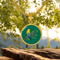 Colourful Bird Personalized Engraved Circle Necklace on emerald green background. Polished surgical steel or with an 18k gold finish option. Necklace: 18-22" adjustable.
Circle Pendant: 0.9” x 0.9” (23.5mm x 23.5mm)