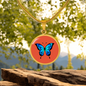 Stunning Blue Butterfly Personalised Engraved Circle Necklace on terracotta orange background. Polished surgical steel or with an 18k gold finish option. Necklace: 18-22" adjustable.
Circle Pendant: 0.9” x 0.9” (23.5mm x 23.5mm)