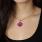Water Lily Birth Flower July Graphic Epoxy Disc Necklace. Clear shiny epoxy shows a light pink petal flower on a darker pink background. The jewellery is made of high quality surgical steel or with an 18k gold finish option with an option to engrave a short love you message or special date. Luxury Necklace: 18-22" (45-56cm) adjustable
Circle Pendant: 0.9” x 0.9” (23.5mm x 23.5mm)