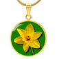 Daffodil Birth Flower March Graphic Epoxy Disc Necklace. Clear shiny epoxy shows a yellow petal flower on a green background. The jewellery is made of high quality surgical steel or with an 18k gold finish option with an option to engrave a short love you message or special date. Luxury Necklace: 18-22" (45-56cm) adjustable
Circle Pendant: 0.9” x 0.9” (23.5mm x 23.5mm)