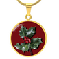 Holly Birth Flower December Graphic Epoxy Disc Necklace. Clear shiny epoxy shows a red berry on green spikey leaf with a darker red background. The jewellery is made of high quality surgical steel or with an 18k gold finish option with an option to engrave a short love you message or special date. Luxury Necklace: 18-22" (45-56cm) adjustable
Circle Pendant: 0.9” x 0.9” (23.5mm x 23.5mm)