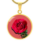 Rose Birth Flower June Graphic Epoxy Disc Necklace. Clear shiny epoxy shows a red petal flower and green stem on a pink background. The jewellery is made of high quality surgical steel or with an 18k gold finish option with an option to engrave a short love you message or special date. Luxury Necklace: 18-22" (45-56cm) adjustable
Circle Pendant: 0.9” x 0.9” (23.5mm x 23.5mm)