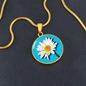 Daisy Birth Flower April Graphic Epoxy Disc Necklace. Clear shiny epoxy shows a white petal flower with yellow canter on a light blue background. The jewellery is made of high quality surgical steel or with an 18k gold finish option with an option to engrave a short love you message or special date. Luxury Necklace: 18-22" (45-56cm) adjustable
Circle Pendant: 0.9” x 0.9” (23.5mm x 23.5mm)