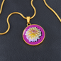 Aster Birth Flower September Graphic Epoxy Disc Necklace. Clear shiny epoxy shows a light yellow petal flower on a lighter pink background. The jewellery is made of high quality surgical steel or with an 18k gold finish option with an option to engrave a short love you message or special date. Luxury Necklace: 18-22" (45-56cm) adjustable
Circle Pendant: 0.9” x 0.9” (23.5mm x 23.5mm)