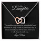 To My Daughter, two lovely interlocking heart pendants embellished with CZ crystals. High quality polished surgical steel and rose gold finish.