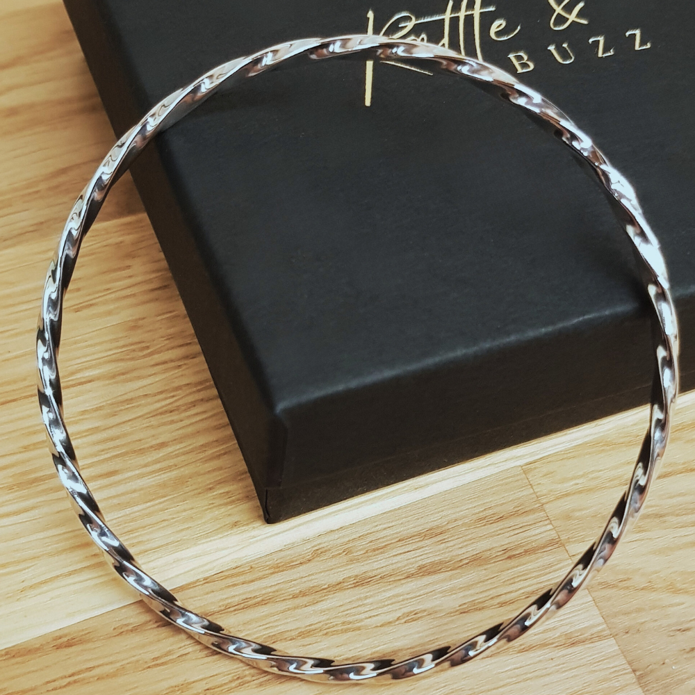 This Beautiful Silver Twist Bangle is a 3mm wide rounded design in 925 twisted silver work with a high polish and looks amazing. The 925 Silver Twist Bangle is designed to be worn on it's own or added to in multiples. It is 65mm round and slides nicely over the hand.