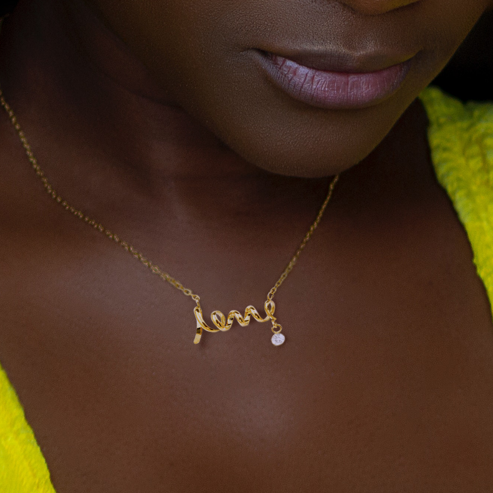 Pendant necklace cursive design spells LOVE. Polished stainless steel or 18k gold finish. Message card To My Beautiful Wife  