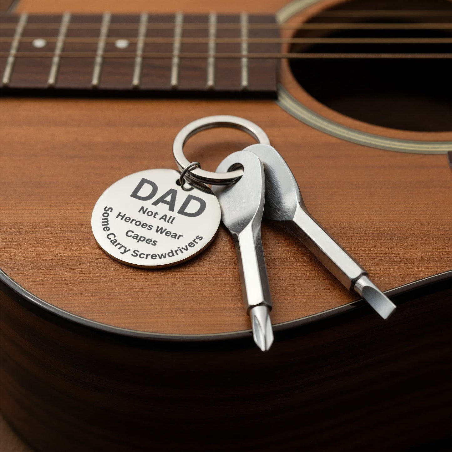 Engraved  keychain screwdriver for DAD with flathead and Philips. Message reads DAD not all heroes wear capes, some carry screwdrivers. Add your own engraved message on the back. Colour Black or Silver.
