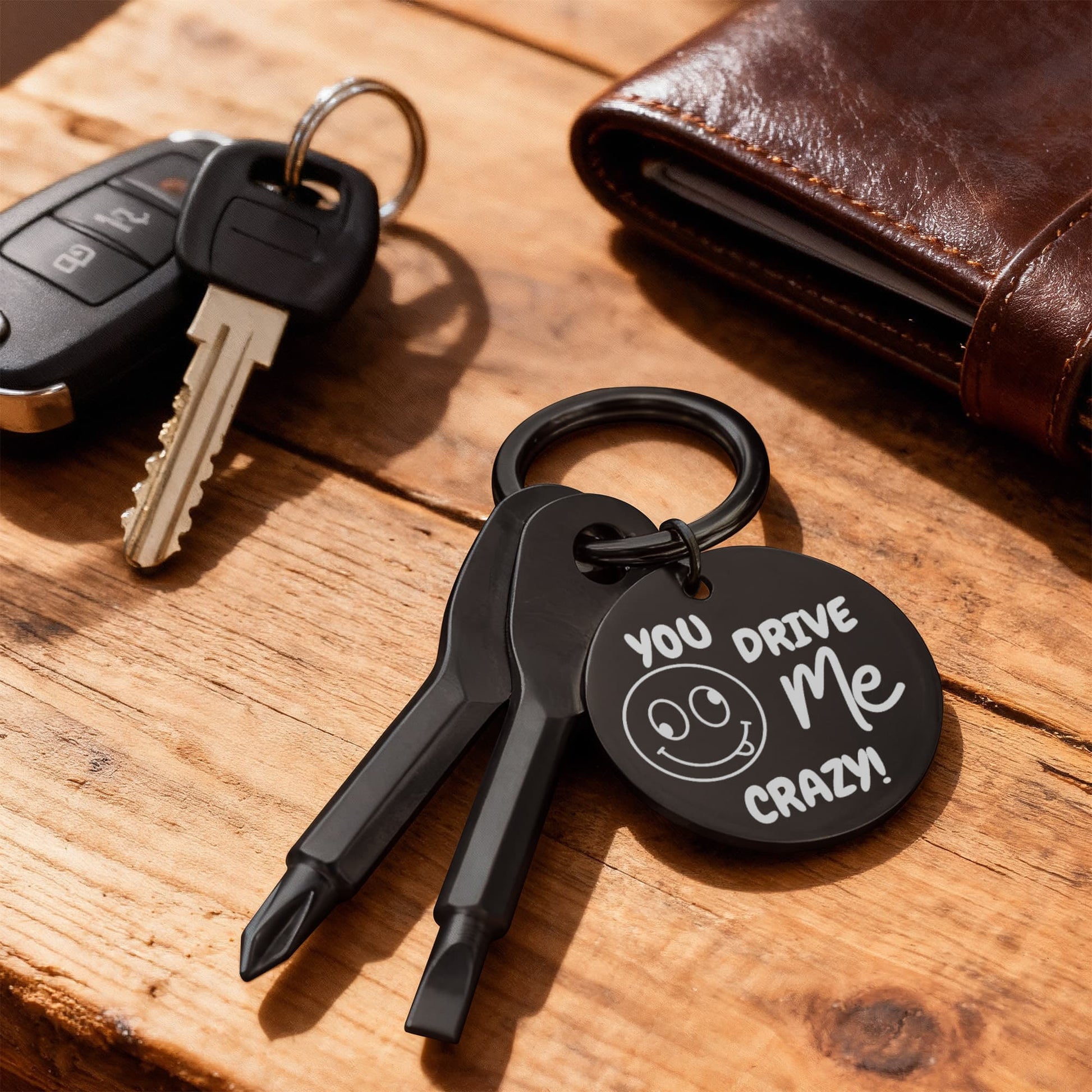 Engraved keychain screwdriver for your loved one with flathead and Philips. Cheeky message reads You drive me crazy! with a googly face. Add your own engraved message on the back. Colour Black or Silver.