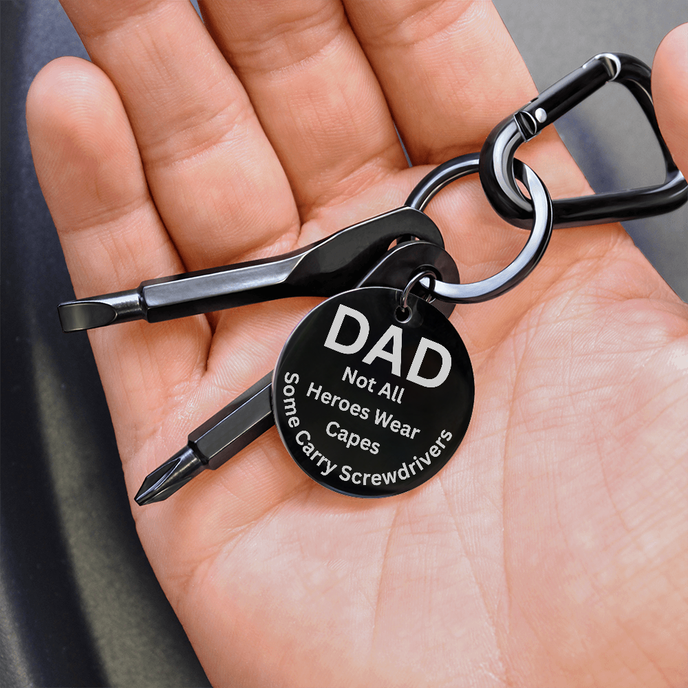 Engraved  keychain screwdriver for DAD with flathead and Philips. Message reads DAD not all heroes wear capes, some carry screwdrivers. Add your own engraved message on the back. Colour Black or Silver.