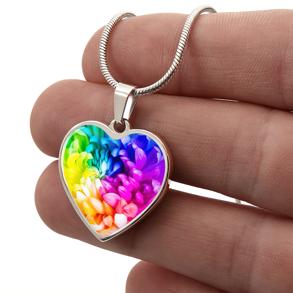 Rainbow Flower Graphic Necklace. A rainbow flower symbolises joy, diversity, and hope. Because of its vibrant mix of colours, it represents happiness, positivity, and inclusivity. Our patent-pending jewellery is made of high quality surgical steel or with an 18k gold finish option. Perfect Gift For:
Birthdays & Anniversaries
Pride Celebrations 
Mother’s Day & Valentine’s Day
Someone who brightens your life!
