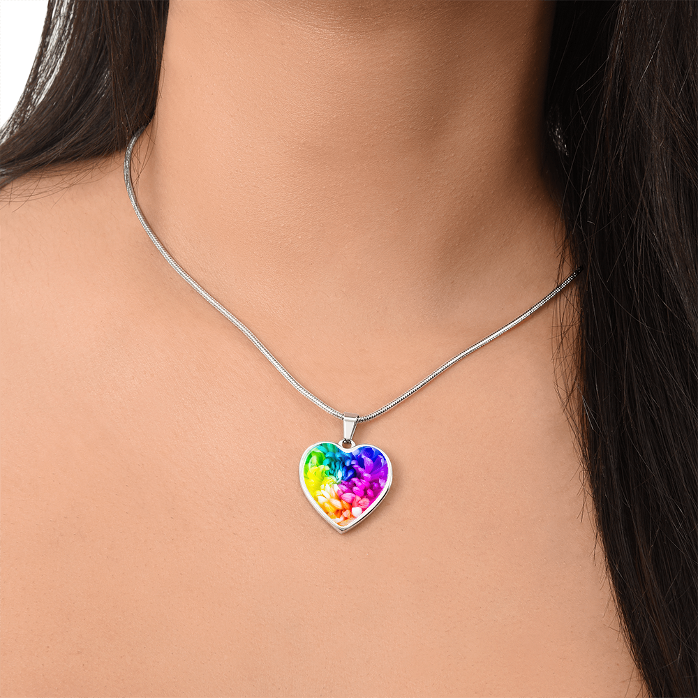 Rainbow Flower Graphic Necklace. A rainbow flower symbolises joy, diversity, and hope. Because of its vibrant mix of colours, it represents happiness, positivity, and inclusivity. Our patent-pending jewellery is made of high quality surgical steel or with an 18k gold finish option. Perfect Gift For:
Birthdays & Anniversaries
Pride Celebrations 
Mother’s Day & Valentine’s Day
Someone who brightens your life!