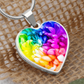 Rainbow Flower Graphic Necklace. A rainbow flower symbolises joy, diversity, and hope. Because of its vibrant mix of colours, it represents happiness, positivity, and inclusivity. Our patent-pending jewellery is made of high quality surgical steel or with an 18k gold finish option. Perfect Gift For:
Birthdays & Anniversaries
Pride Celebrations 
Mother’s Day & Valentine’s Day
Someone who brightens your life!