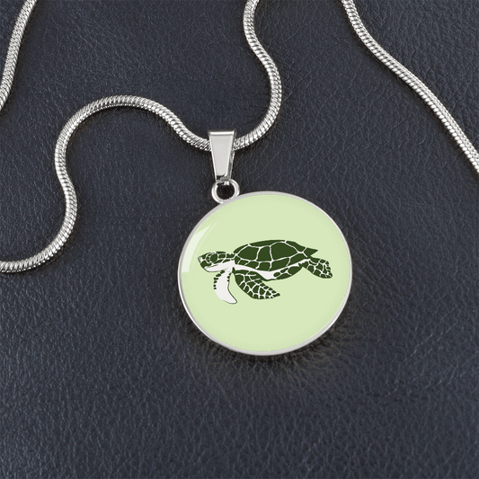 Dainty Sea Turtle Circle Necklace, Lime Cream Personalized Engraved Circle Necklace. Polished surgical steel or with an 18k gold finish option. Necklace: 18-22" adjustable.
Circle Pendant: 0.9” x 0.9” (23.5mm x 23.5mm)