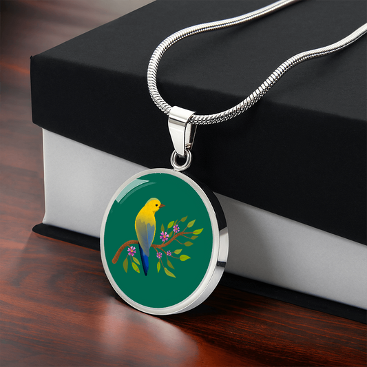Colourful Bird Personalized Engraved Circle Necklace on emerald green background. Polished surgical steel or with an 18k gold finish option. Necklace: 18-22" adjustable.
Circle Pendant: 0.9” x 0.9” (23.5mm x 23.5mm)