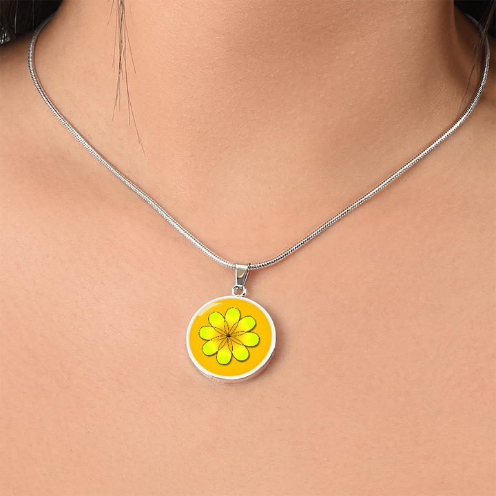 Yellow Daisy on darker orange background disc resin Necklace. Personalized Engraved Circle Necklace. Polished surgical steel or with an 18k gold finish option. Necklace: 18-22 inches adjustable.
Circle Pendant: 0.9” x 0.9” (23.5mm x 23.5mm)