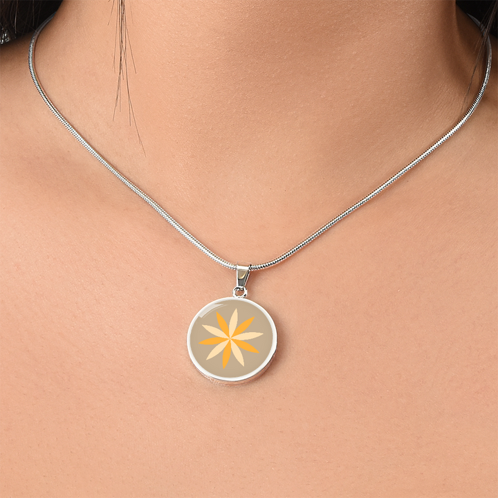 Floral Personalised Engraved Circle Necklace on warm sand background. Polished surgical steel or with an 18k gold finish option. Necklace: 18-22" adjustable.
Circle Pendant: 0.9” x 0.9” (23.5mm x 23.5mm)