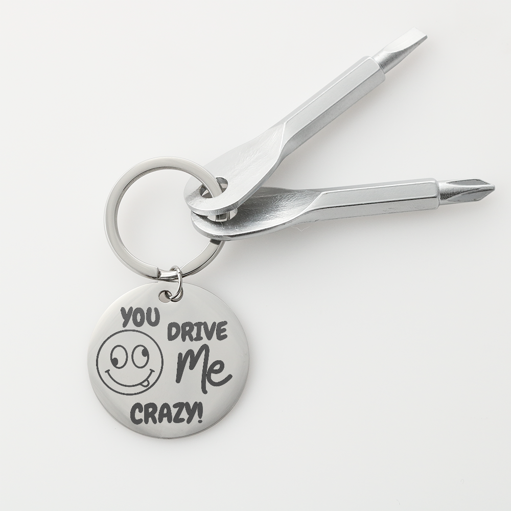 Engraved keychain screwdriver for your loved one with flathead and Philips. Cheeky message reads You drive me crazy! with a googly face. Add your own engraved message on the back. Colour Black or Silver.