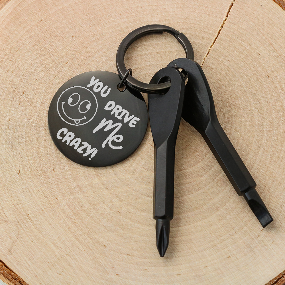 Engraved keychain screwdriver for your loved one with flathead and Philips. Cheeky message reads You drive me crazy! with a googly face. Add your own engraved message on the back. Colour Black or Silver.