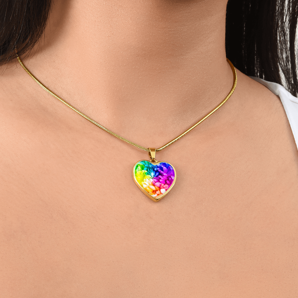 Rainbow Flower Graphic Necklace. A rainbow flower symbolises joy, diversity, and hope. Because of its vibrant mix of colours, it represents happiness, positivity, and inclusivity. Our patent-pending jewellery is made of high quality surgical steel or with an 18k gold finish option. Perfect Gift For:
Birthdays & Anniversaries
Pride Celebrations 
Mother’s Day & Valentine’s Day
Someone who brightens your life!