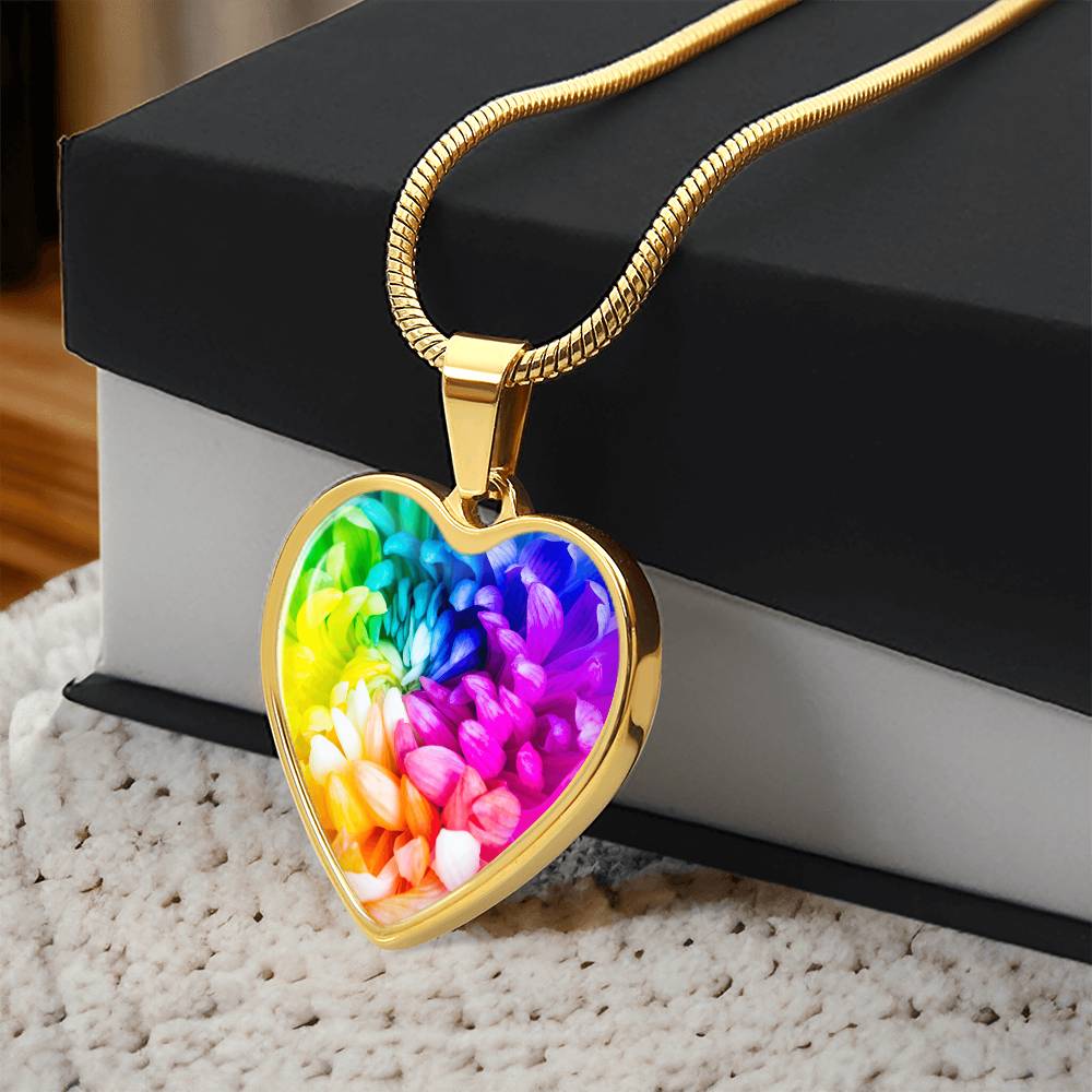 Rainbow Flower Graphic Necklace. A rainbow flower symbolises joy, diversity, and hope. Because of its vibrant mix of colours, it represents happiness, positivity, and inclusivity. Our patent-pending jewellery is made of high quality surgical steel or with an 18k gold finish option. Perfect Gift For:
Birthdays & Anniversaries
Pride Celebrations 
Mother’s Day & Valentine’s Day
Someone who brightens your life!