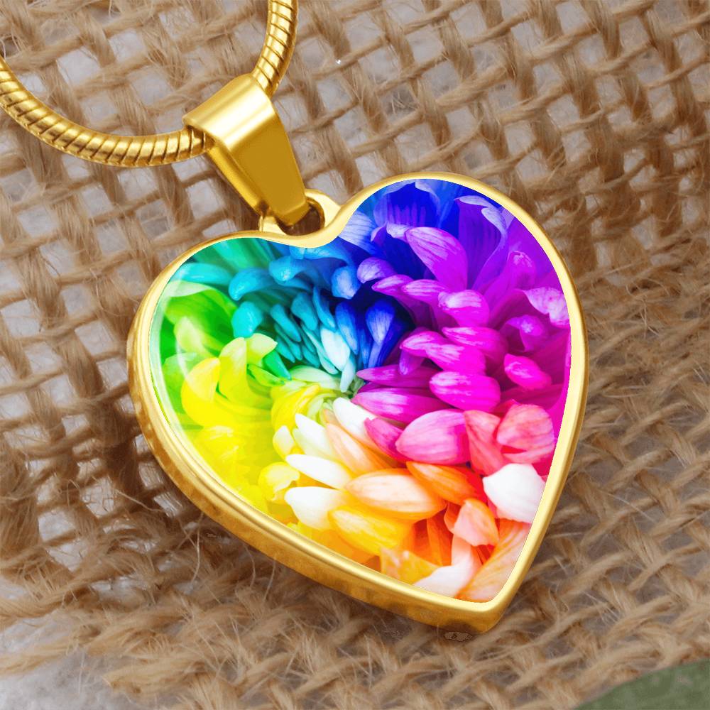 Rainbow Flower Graphic Necklace. A rainbow flower symbolises joy, diversity, and hope. Because of its vibrant mix of colours, it represents happiness, positivity, and inclusivity. Our patent-pending jewellery is made of high quality surgical steel or with an 18k gold finish option. Perfect Gift For:
Birthdays & Anniversaries
Pride Celebrations 
Mother’s Day & Valentine’s Day
Someone who brightens your life!