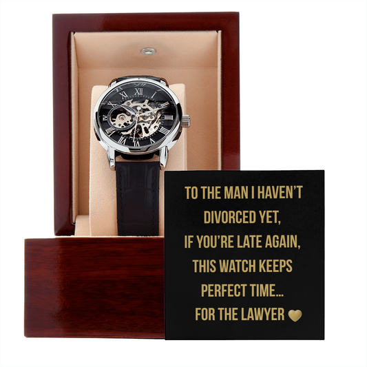 Black and gold graphic with bold text: “To the man I haven’t divorced yet, If you’re late again, this watch keeps perfect time… for the lawyer” with a gold heart emoji. Savage message card for men’s handsome skeleton watch.