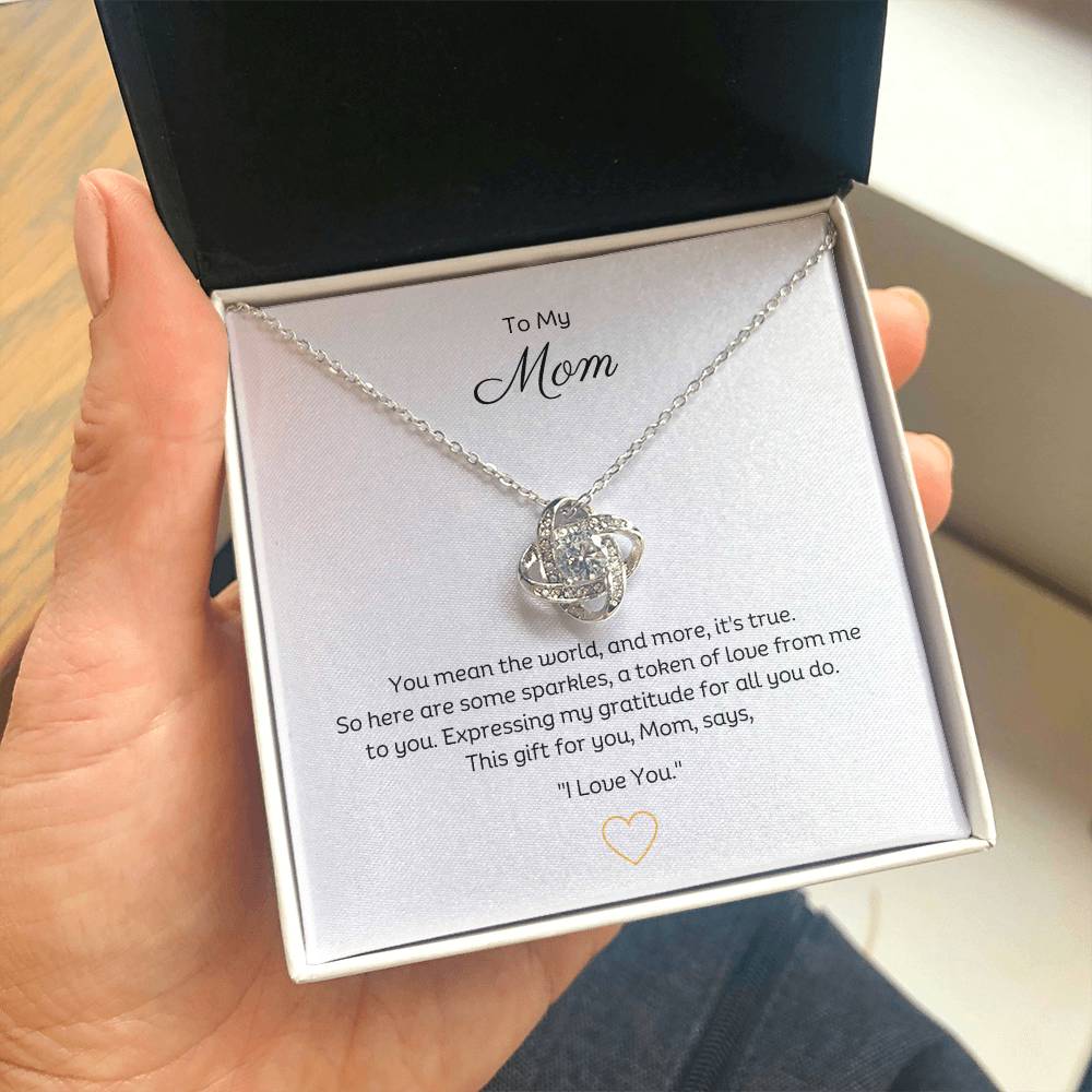 To My Mom, Beautiful Love Knot 14k or 18k finish Necklace. Features a beautiful pendant embellished with premium cubic zirconia crystals.